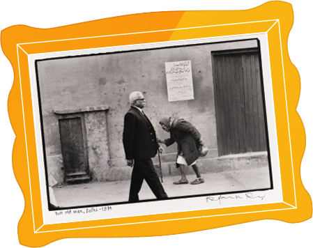 Black and white photograph of two old men on a Delhi street