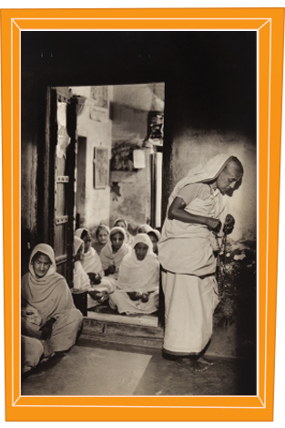 Black and white photograph of women gathered at a doorway